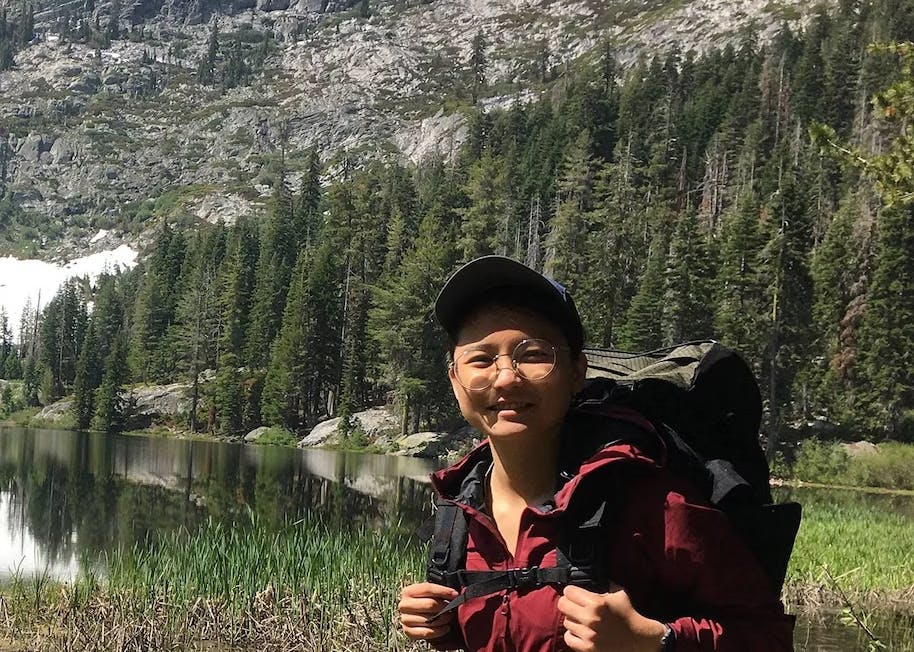 An image of Minh Nguyen, Staff Software Engineer, hiking outdoors.
