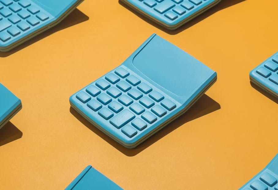 An image of a blue calculator on a yellow background.